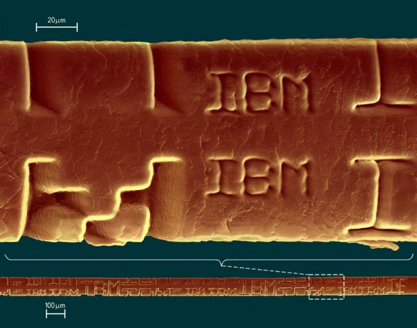 An IBM excimer laser etching ‘IBM’ on the surface of a human hair to show its accuracy and low impact to surrounding tissue.