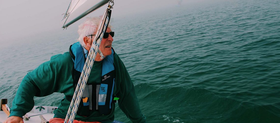 Elderly man sailing